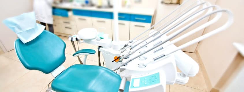 Professional Dentist tools and chair in the dental office.